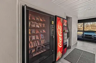 a vending machine filled with soda and coke at Motel 6 Lester - Philadelphia Airport in Lester