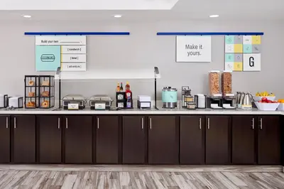 a kitchen with a counter with some food on it at Garner Hotel Mahwah by IHG in Mahwah