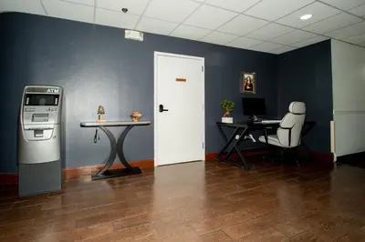 an office with a desk and a white door at Scottish Inns & Suites - North Hershey in Harrisburg