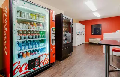 a coca cola refrigerator in a store at Extended Stay America Suites - Elizabeth - Newark Airport in Elizabeth