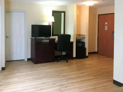 a room with a computer and a desk with a chair at Econo Lodge Harrisburg - Hershey in Harrisburg