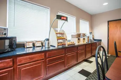 a kitchen with a counter with some food on it at Econo Lodge Harrisburg - Hershey in Harrisburg