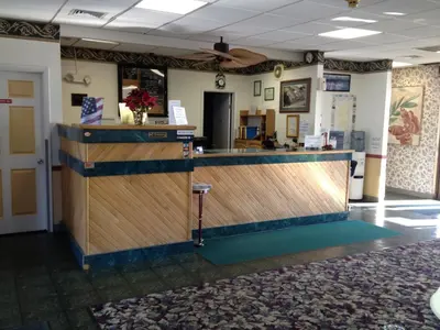 a lobby with a reception desk and a counter at Super 8 by Wyndham Carlisle North in Carlisle