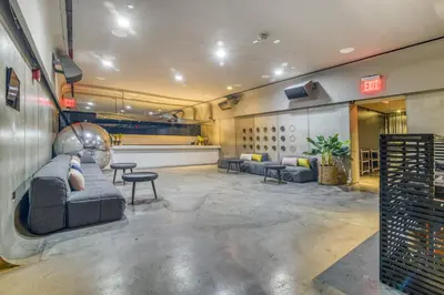 a waiting room with couches and chairs in a building at Hotel Alameda, Highline in New York