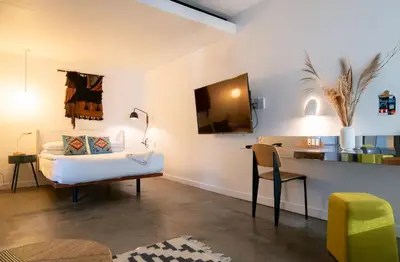 a room with a bed and a desk with a chair at Hotel Alameda, Highline in New York