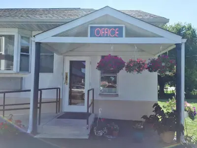an office building with a sign that reads office at Scottish Inns Ronks in Ronks