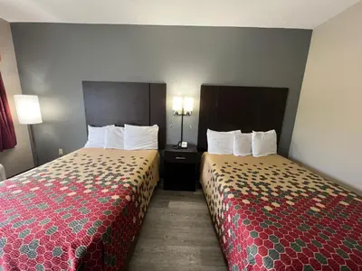 a hotel room with two beds in a room at Scottish Inns Ronks in Ronks