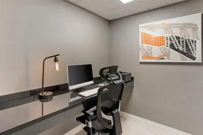 an office with a desk with a computer on it at Best Western Plus Heritage Rail Inn & Suites in York
