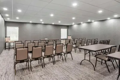 a conference room with tables and chairs in it at Best Western Plus Heritage Rail Inn & Suites in York