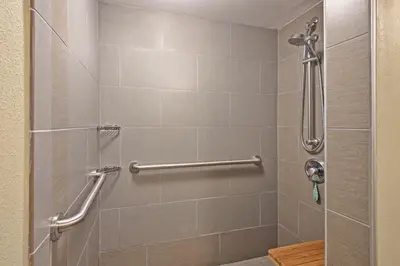 a bathroom with a shower with a glass door at Holiday Inn Harrisburg East by IHG in Middletown