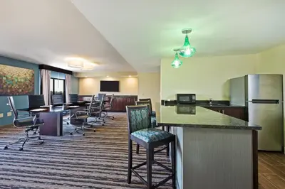 an office with a bar and chairs in a room at Holiday Inn Harrisburg East by IHG in Middletown