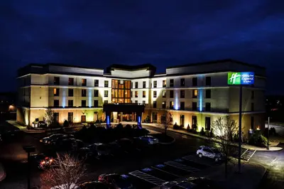 a large building with a parking lot in front of it at Holiday Inn Express & Suites Harrisburg West in Mechanicsburg