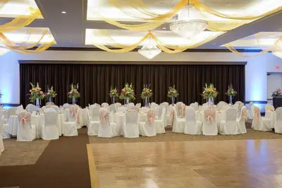 a row of tables and chairs in a banquet hall at DoubleTree by Hilton Binghamton in Binghamton