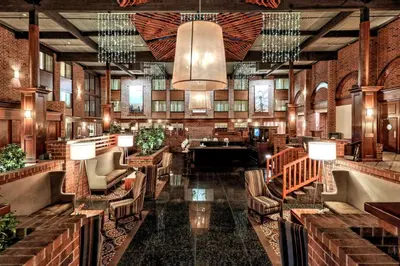 a lobby of a hotel with chairs and tables at Best Western Premier the Central Hotel & Conference Center in Harrisburg