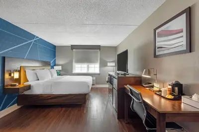 a hotel room with a bed and a desk at Comfort Inn & Suites Pottstown Eastern Gateway in Pottstown