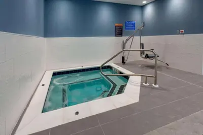 a jacuzzi tub in a bathroom with at La Quinta Inn & Suites by Wyndham Middletown-Goshen in Middletown