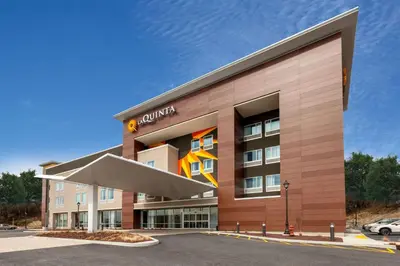 a rendering of the front of a building at La Quinta Inn & Suites by Wyndham Middletown-Goshen in Middletown