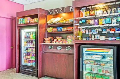 a store with a refrigerator and a pantry with food at Ramada by Wyndham Rockaway in Rockaway