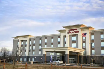 a building with a sign on the front of it at Hampton Inn & Suites Mount Laurel/Moorestown in Mount Laurel
