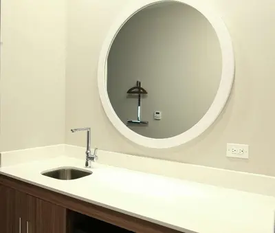 a bathroom with a sink and a large mirror at Hampton Inn & Suites Mount Laurel/Moorestown in Mount Laurel