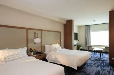 a hotel room with two beds and a window at Fairfield Inn & Suites by Marriott Philadelphia Valley Forge/Great Valley in Berwyn