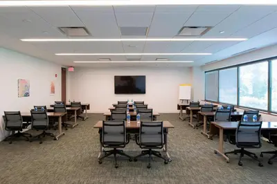 a classroom with desks and chairs in a room at Fairfield Inn & Suites by Marriott Philadelphia Valley Forge/Great Valley in Berwyn