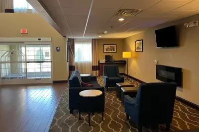 a waiting room with couches and chairs at Days Inn & Suites by Wyndham Manheim Lebanon in Manheim