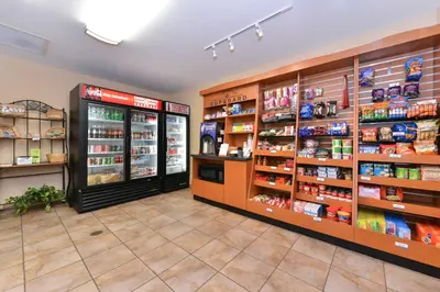 a grocery store aisle with products on the shelves at Candlewood Suites Elmira Horseheads by IHG in Horseheads