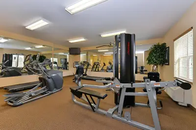 a gym with treadmills and elliptical machines at Candlewood Suites Elmira Horseheads by IHG in Horseheads