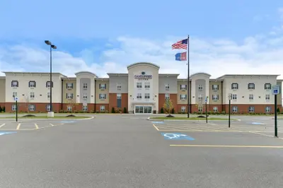 an empty parking lot in front of a building at Candlewood Suites Elmira Horseheads by IHG in Horseheads