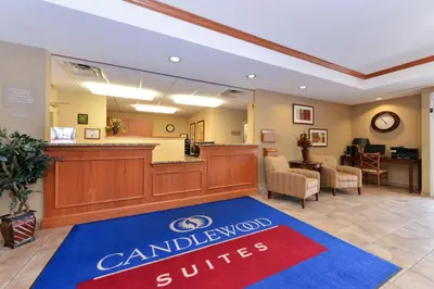 a lobby of a dental office with a canadian smiles sign at Candlewood Suites Elmira Horseheads by IHG in Horseheads