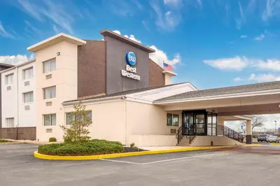 a hotel front of a building with an american flag at Best Western Westgate Inn in York