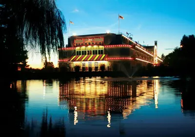 a building with lights in the middle of a body of water at Fulton Steamboat Inn in Lancaster