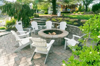 a group of white chairs sitting around a fire pit at Fulton Steamboat Inn in Lancaster