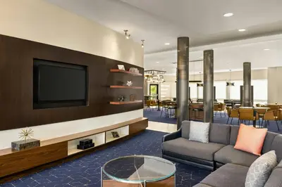 a living room with a tv and a couch at Courtyard Mt. Holly Westampton in Westampton Township