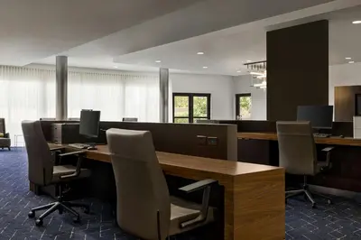 an office with a desk with chairs and computer monitors at Courtyard Mt. Holly Westampton in Westampton Township