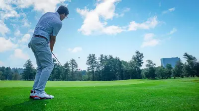 a man is playing golf on a golf course at Resorts World Catskills in Monticello