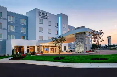 a hotel with a building with a sign on it at Fairfield Inn & Suites by Marriott Harrisburg International Airport in Middletown