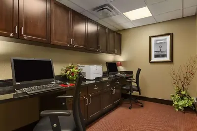 an office with a desk with a laptop computer on it at Homewood Suites by Hilton Binghamton/Vestal in Vestal