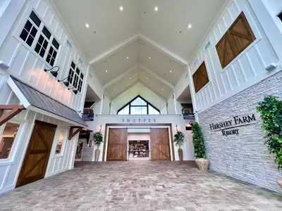 an empty lobby of a store with wooden doors at Hershey Farm Resort in Ronks