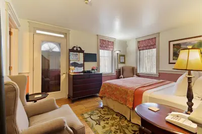 a hotel room with a bed and a desk at After Eight Bed and Breakfast in Ronks