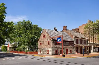 an old building on the corner of a street at Ramada by Wyndham York Harrisburg Hershey in York
