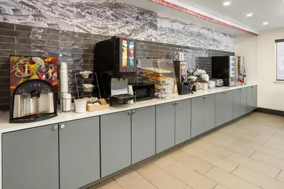 a counter in a restaurant with a counter sidx sidx sidx at Ramada by Wyndham York Harrisburg Hershey in York
