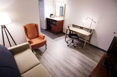 a room with a desk and a chair and a desk at Country Inn & Suites by Radisson, Harrisburg West Mechanicsburg in Mechanicsburg