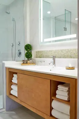 a bathroom with a sink and a shower at Concorde Hotel New York in New York