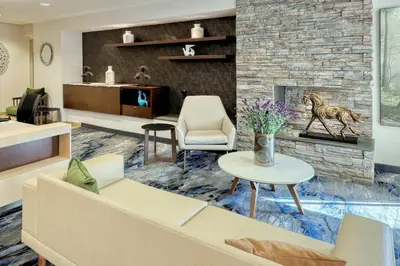a living room with a couch and a fireplace at Fairfield Inn & Suites by Marriott Harrisburg West/New Cumberland in New Cumberland