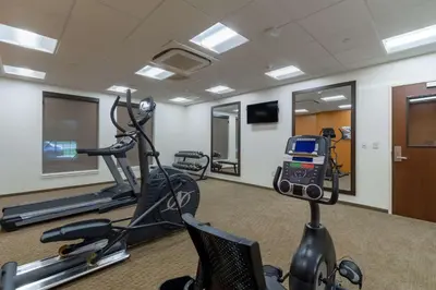 a fitness room with a treadmill and a gym at Comfort Inn & Suites - Harrisburg Airport - Hershey South in Middletown