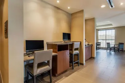 an office with a desk with a computer and chairs at Comfort Inn & Suites - Harrisburg Airport - Hershey South in Middletown