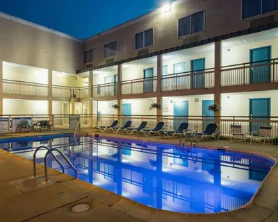 a swimming pool in front of a hotel at Quality Inn Newark - Wilmington in Newark
