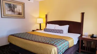 a hotel room with a bed and a picture on the wall at Hampton Inn (not a Hilton Affiliate) Camp Hill - Harrisburg SW in Harrisburg